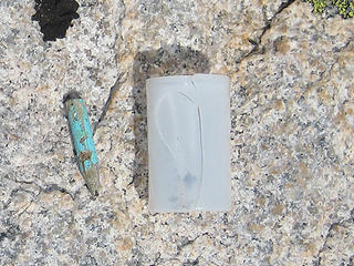 Pencil stub and empty film canister found on summit