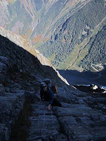 Daniel high on the NE Buttress.  That is the Cascade Pass parking lot down there.