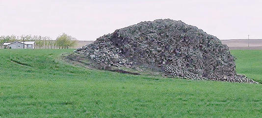 Bedload boulders stacked around haystack rock
