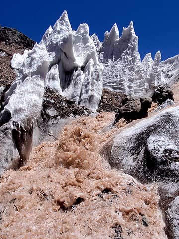 Ice Towers Over Brown Water