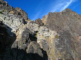Last gully upward to crest between east summit (right) and main summit (left).  (Note Yana in shadow)