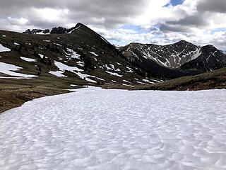 We used a convenient snow finger for the descent from the unnamed pass N of Larch Pass. Corral Peak and Two Point now in our sights.