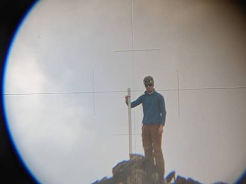 Nick holding the meter stick on the south summit of Cardinal while I sighted with the theodolite, June 2023