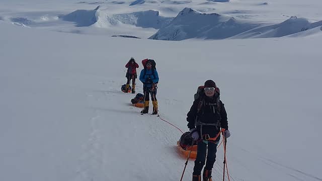 Group hauling sleds up Branscomb Glacier to Low Camp. Photo by Ossy.