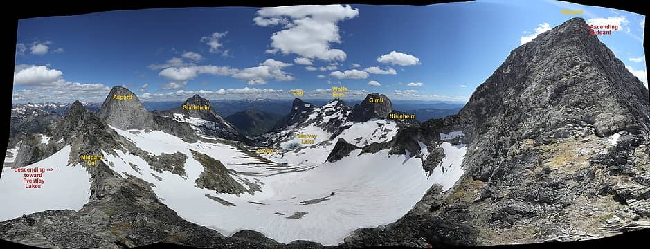 180-degree pan from midway up Midgard, with Erik descending beyond the col on right and scramblers ascending toward the summit on left
