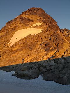 Sunset shadow on Middle Challenger (scramble route goes up to the snowfield, over to the right edge, back to the left edge, then back to the middle and up)
