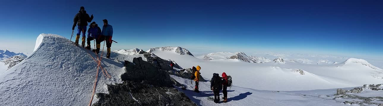 Pano shot of group on summit. Photo by Ossy.