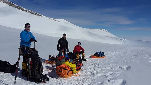 J.P., Urszula and Dave taking a break from hauling sleds on the Branscomb Glacier. Photo by Ossy.