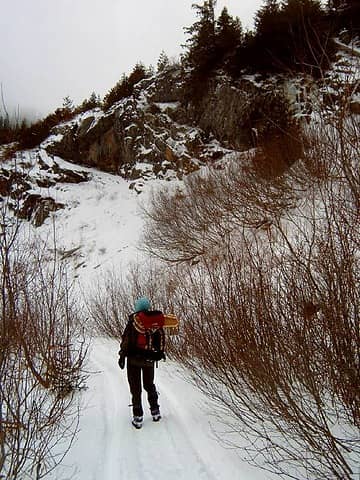 A friend takes snowshoes for a hike